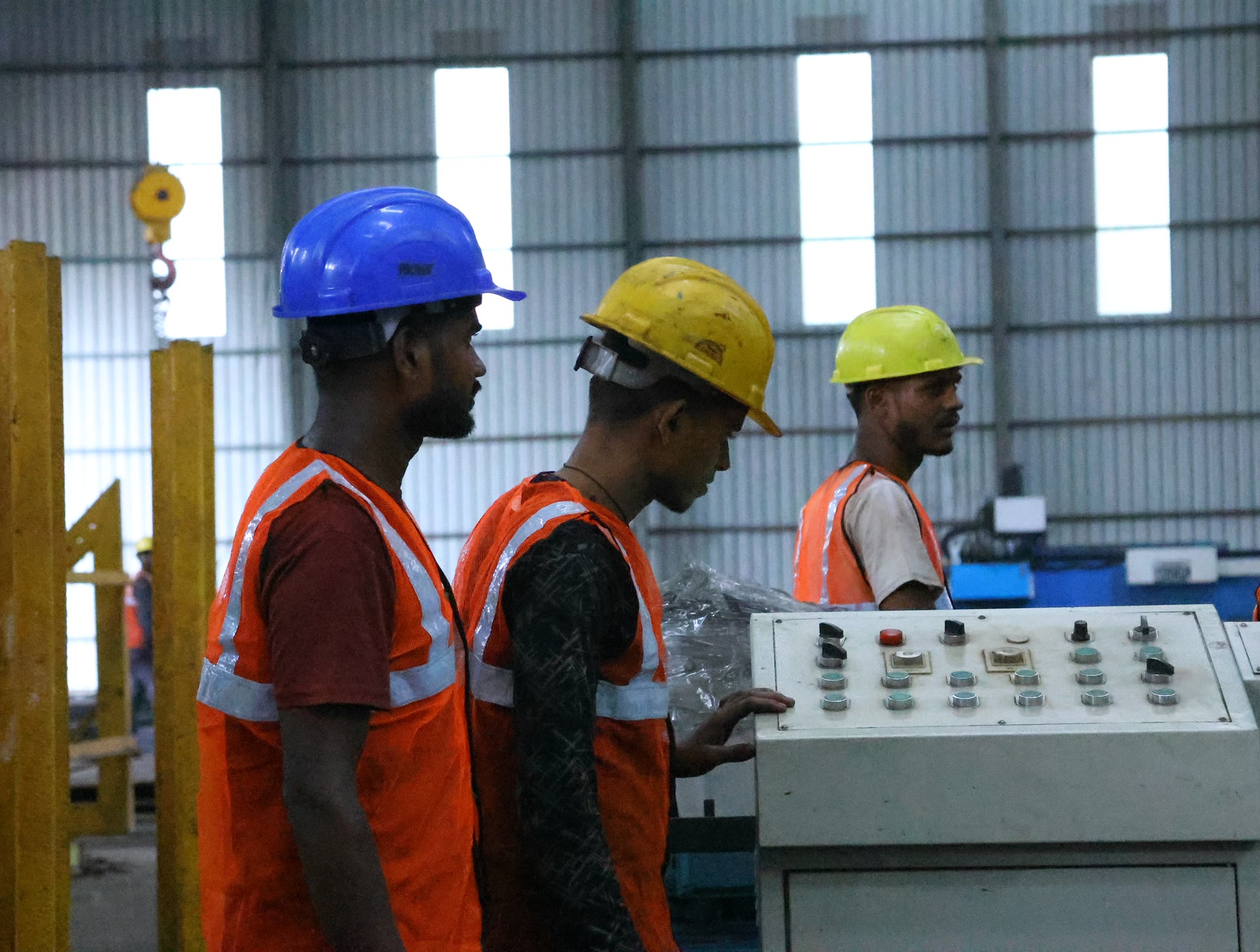 Operators at the CNC console
