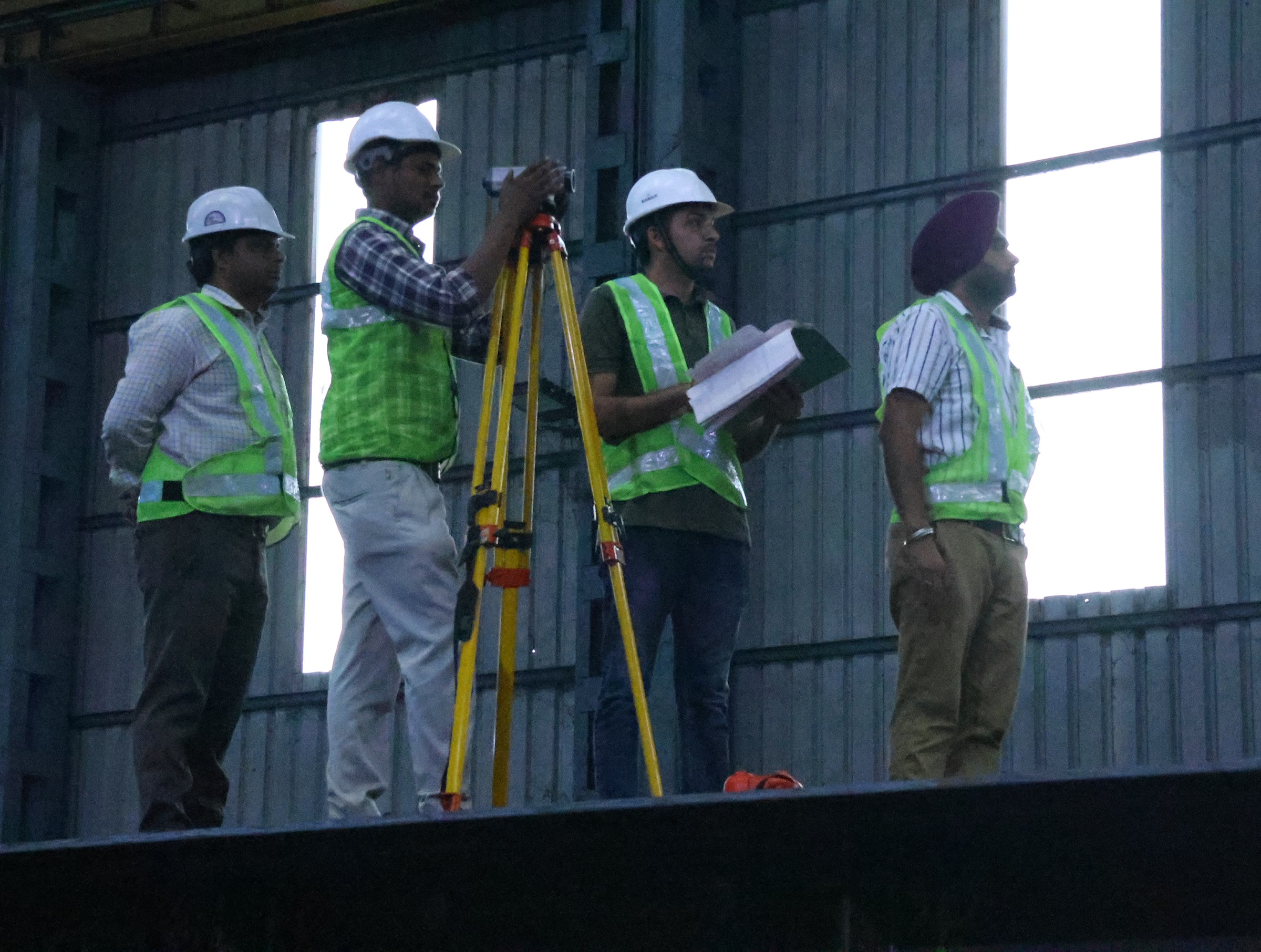 Survey team on a girder