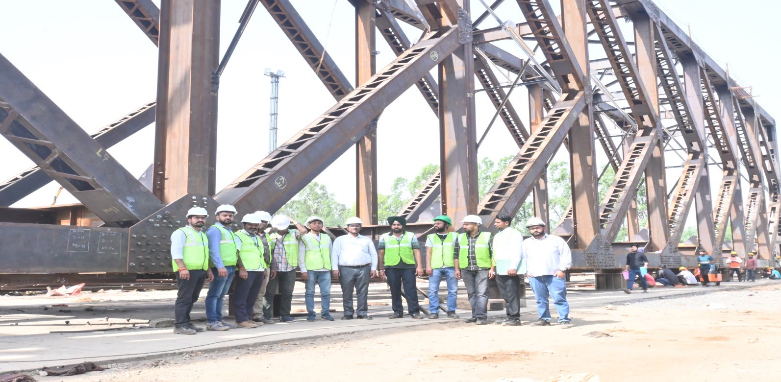 Assembly team beneath a completed truss girder